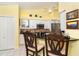 Kitchen features a breakfast bar and stainless steel appliances at 49 Perimeter Dr, Englewood, FL 34223