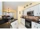 Kitchen offers granite counters, stainless steel appliances, and lots of cabinet space at 49 Perimeter Dr, Englewood, FL 34223