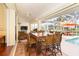 Lanai with dining table and chairs, offering views of the pool at 49 Perimeter Dr, Englewood, FL 34223