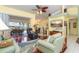 Open living space with hardwood floors, showing the dining and living areas at 49 Perimeter Dr, Englewood, FL 34223