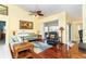 Bright living room with hardwood floors, comfortable seating, and access to a lanai at 49 Perimeter Dr, Englewood, FL 34223