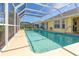 Inviting screened-in pool with ample deck space at 49 Perimeter Dr, Englewood, FL 34223