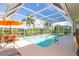 Inviting pool with a screened enclosure and patio furniture at 49 Perimeter Dr, Englewood, FL 34223