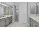 Spa-like bathroom with double vanity and a walk-in shower at 503 N Tamiami Trl # 301, Venice, FL 34285