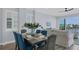 Bright dining area with water views and stylish decor at 503 N Tamiami Trl # 301, Venice, FL 34285