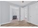Light and airy hallway with hardwood floors and neutral walls at 503 N Tamiami Trl # 301, Venice, FL 34285