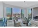 Living room with water views and access to balcony; comfortable seating at 503 N Tamiami Trl # 301, Venice, FL 34285