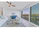 Spacious living room with water views and access to balcony at 503 N Tamiami Trl # 301, Venice, FL 34285