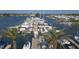Aerial view of a marina with a long pier and many boats at 503 N Tamiami Trl # 301, Venice, FL 34285