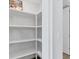 Walk-in pantry with ample shelving for storage at 503 N Tamiami Trl # 301, Venice, FL 34285