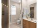 Bathroom with toilet, sink, and shower stall at 5031 Bella Terra Dr, Venice, FL 34293
