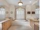 Elegant bathroom with double vanities and a large soaking tub at 5031 Bella Terra Dr, Venice, FL 34293
