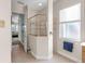 Bathroom with shower, tile floor, and a window at 5031 Bella Terra Dr, Venice, FL 34293
