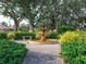 Serene community garden featuring a lovely fountain at 5031 Bella Terra Dr, Venice, FL 34293