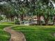 Peaceful walking path with a charming wooden bridge at 5031 Bella Terra Dr, Venice, FL 34293