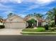 Stunning home exterior with a two-car garage at 5031 Bella Terra Dr, Venice, FL 34293