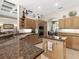 Spacious kitchen with granite counters and island at 5031 Bella Terra Dr, Venice, FL 34293