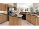 Modern kitchen with stainless steel appliances and granite countertops at 5031 Bella Terra Dr, Venice, FL 34293