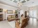 Bright living room with comfy rattan furniture at 5031 Bella Terra Dr, Venice, FL 34293