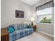 Living room with patterned sofa and wood table at 5031 Bella Terra Dr, Venice, FL 34293