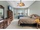 Main bedroom with a king-size bed and built-in shelving at 5031 Bella Terra Dr, Venice, FL 34293