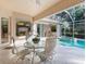 Patio with seating area overlooking the pool at 5031 Bella Terra Dr, Venice, FL 34293