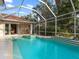 Escape to your own backyard oasis with this screened pool at 5031 Bella Terra Dr, Venice, FL 34293