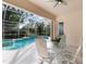 Enjoy this relaxing pool area, complete with a spa and screened enclosure at 5031 Bella Terra Dr, Venice, FL 34293