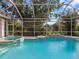 Inviting pool and spa with screened enclosure at 5031 Bella Terra Dr, Venice, FL 34293