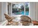 Relaxing view of a refreshing pool and spa from a sunroom at 5031 Bella Terra Dr, Venice, FL 34293