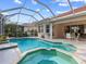 Enjoy the refreshing pool and spa, perfect for entertaining at 5031 Bella Terra Dr, Venice, FL 34293