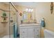 Clean bathroom with granite vanity, walk-in shower, and updated fixtures at 521 Roma Road, Venice, FL 34285