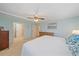 Spacious bedroom with ensuite bathroom access and ceiling fan at 521 Roma Road, Venice, FL 34285