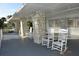 Relaxing community porch with rocking chairs at 521 Roma Road, Venice, FL 34285