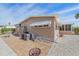 Tan single-wide home with patio, shed, and fire pit at 521 Roma Road, Venice, FL 34285