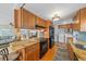 Updated kitchen features granite countertops, wood cabinets, and modern appliances at 521 Roma Road, Venice, FL 34285