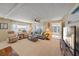 Spacious living room with ample seating, access to the lanai, and TV at 521 Roma Road, Venice, FL 34285