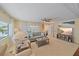 Bright living room with comfy seating, large TV, and access to other rooms at 521 Roma Road, Venice, FL 34285