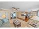 Open-concept living room with hardwood floors, kitchen pass-through, and seating area at 521 Roma Road, Venice, FL 34285