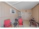 Covered patio with seating area and golf cart parking at 521 Roma Road, Venice, FL 34285