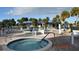 Community pool and spa with lounge chairs at 521 Roma Road, Venice, FL 34285