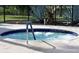 Community hot tub with surrounding patio at 521 Roma Road, Venice, FL 34285
