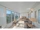 Sunroom features comfy seating and views of the surrounding area at 521 Roma Road, Venice, FL 34285