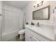 Bathroom featuring a vanity with a large mirror and decorative light fixture above the sink at 525 Manatee Ct # 4, Venice, FL 34285