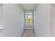 Bright hallway with a window offering natural light and views at 5541 Rosehill Rd # 201, Sarasota, FL 34233