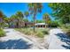 Beach access with gazebo and walkways, surrounded by palm trees at 5838 Tyler Rd, Venice, FL 34293