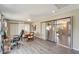 Open floor plan connecting dining area to living room with sliding glass doors at 5838 Tyler Rd, Venice, FL 34293