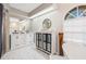 Bathroom with a walk-in shower, double vanity, and marble floors at 610 Woodview Way, Bradenton, FL 34212