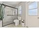 Updated bathroom with marble shower and modern fixtures at 610 Woodview Way, Bradenton, FL 34212