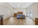 Spacious bedroom with a queen bed and access to the pool at 610 Woodview Way, Bradenton, FL 34212